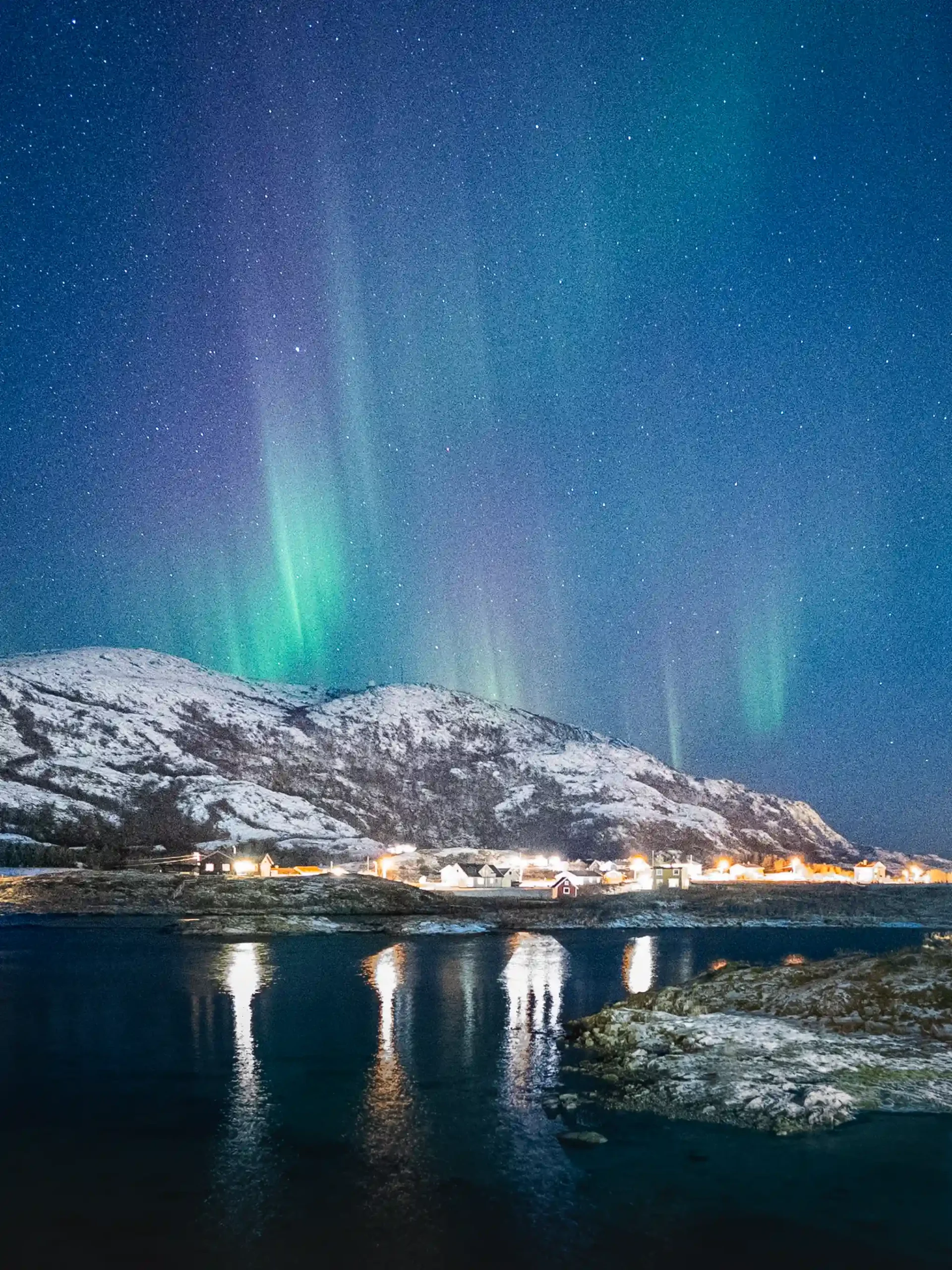 Cabins and the the Northern lights at Sommarøy outside Tromsø, Norway
