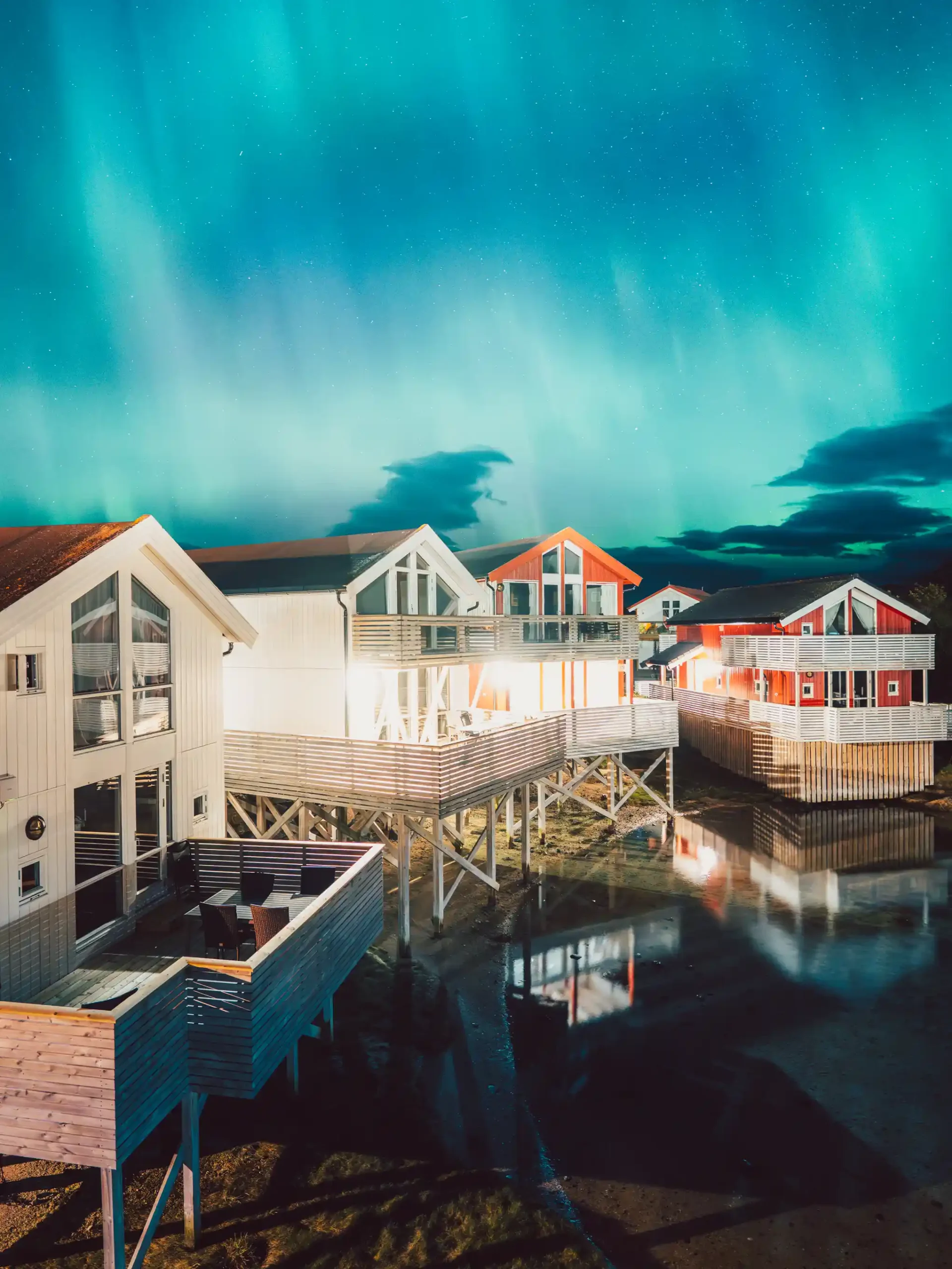 Cabins and the the Northern lights at Sommarøy outside Tromsø, Norway
