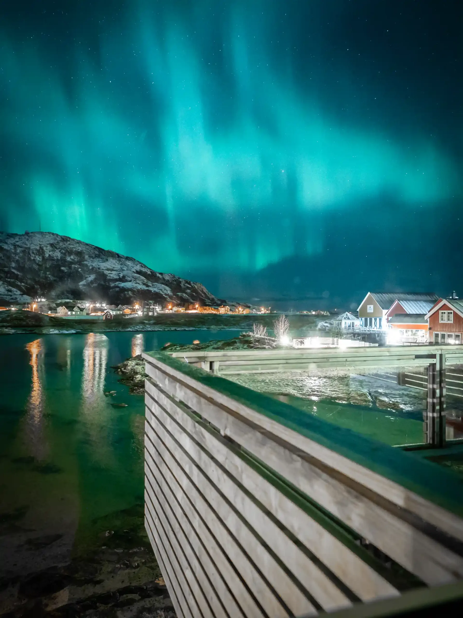 Cabins and the the Northern lights at Sommarøy outside Tromsø, Norway
